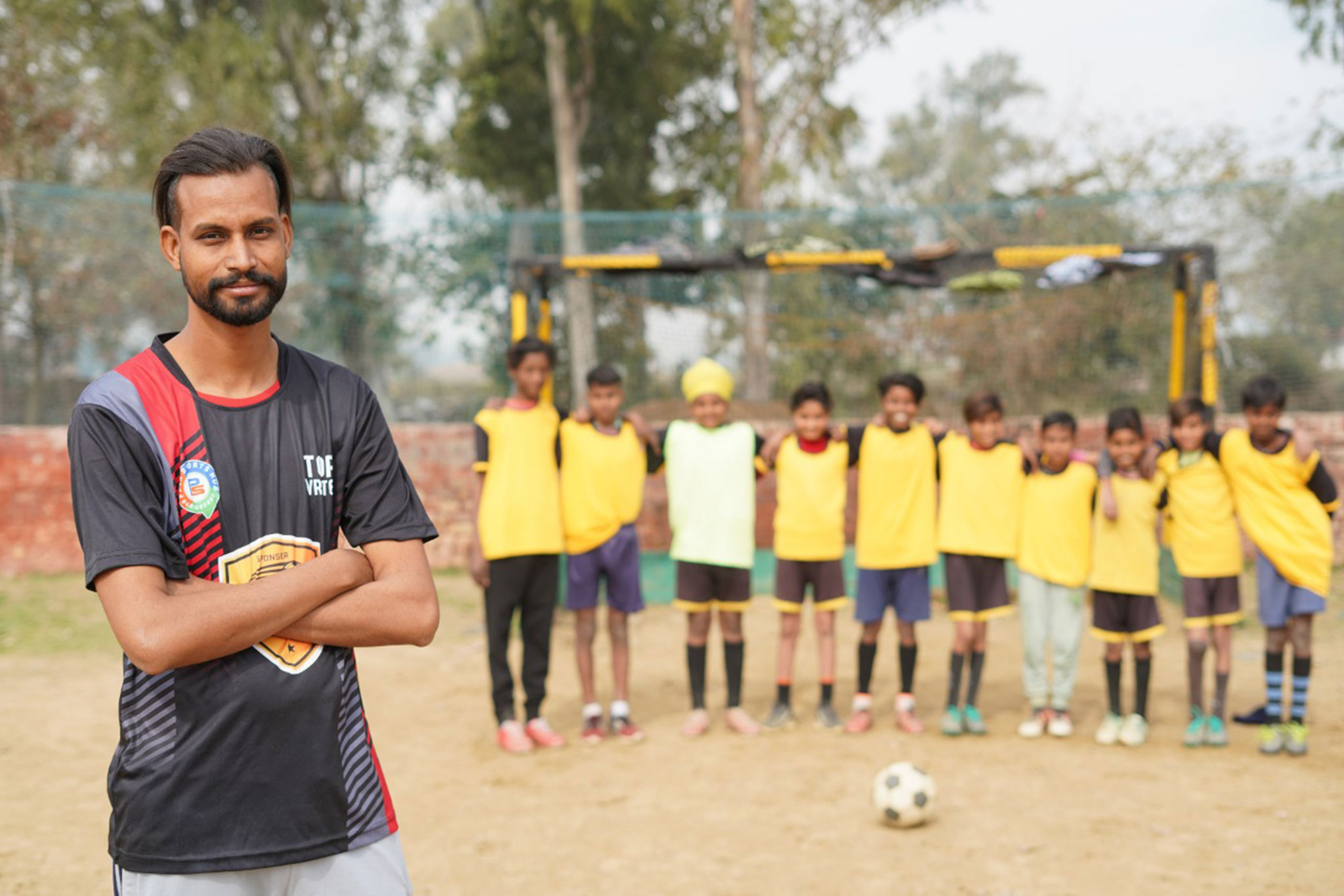Security Guard By Night, Football Coach To Village Kids By Day