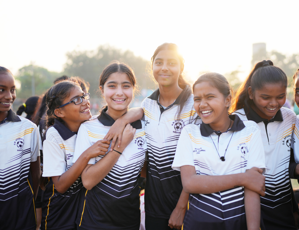 Girls take a break after their football practice session in Rasoolra village.